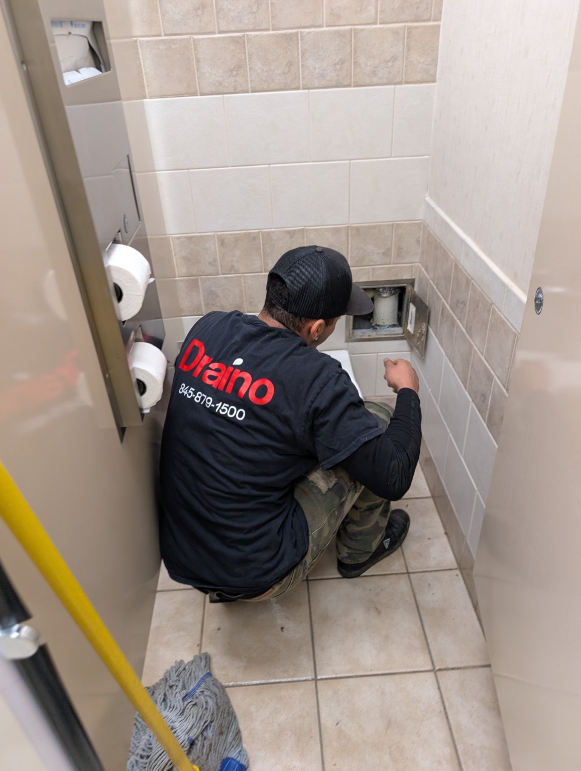 Draino technician working on a drain